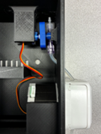 Inside the pump enclosure: drive motor, tubing path and wiring.